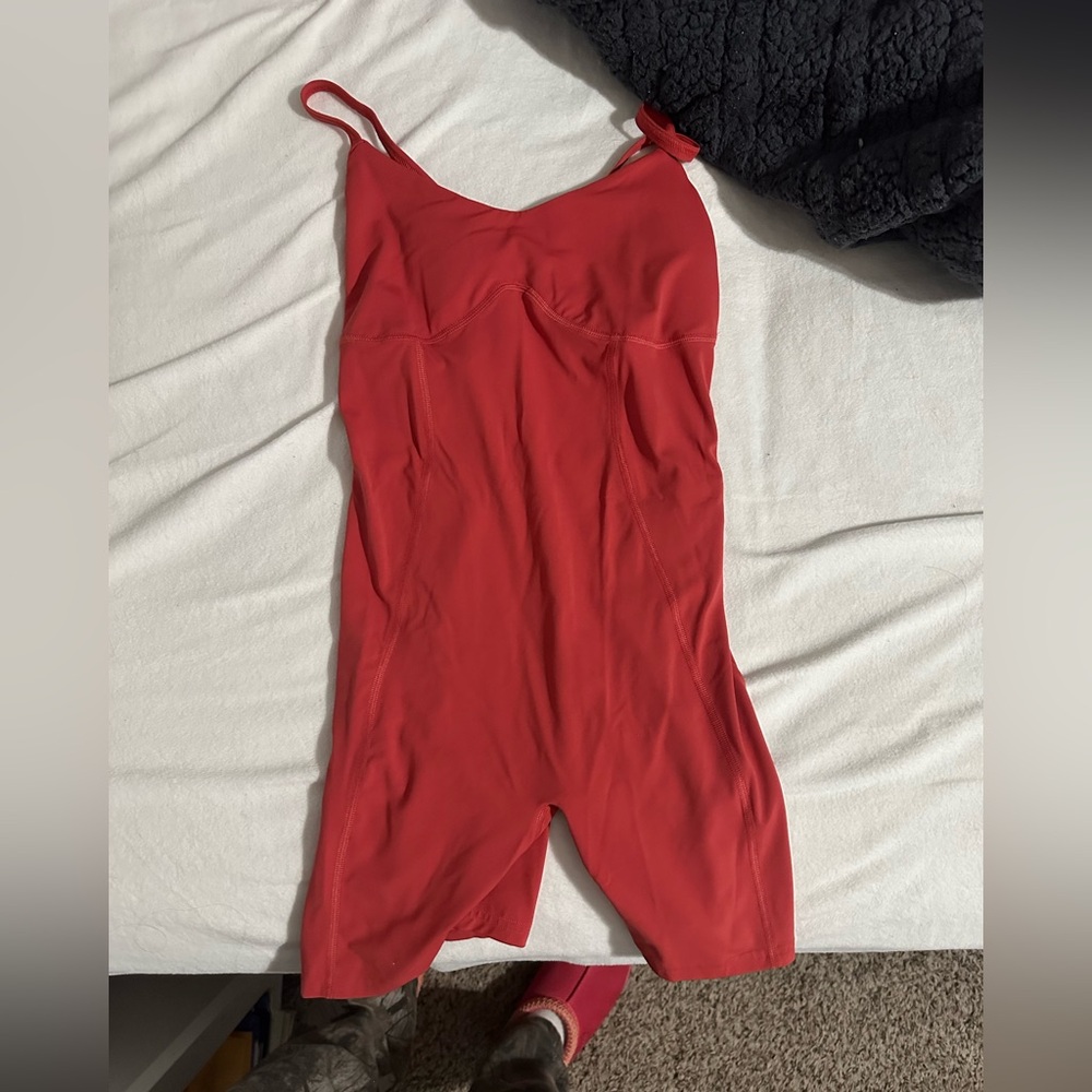 Gymshark one piece never worn. Adjustable straps. Size small color Sundried Red